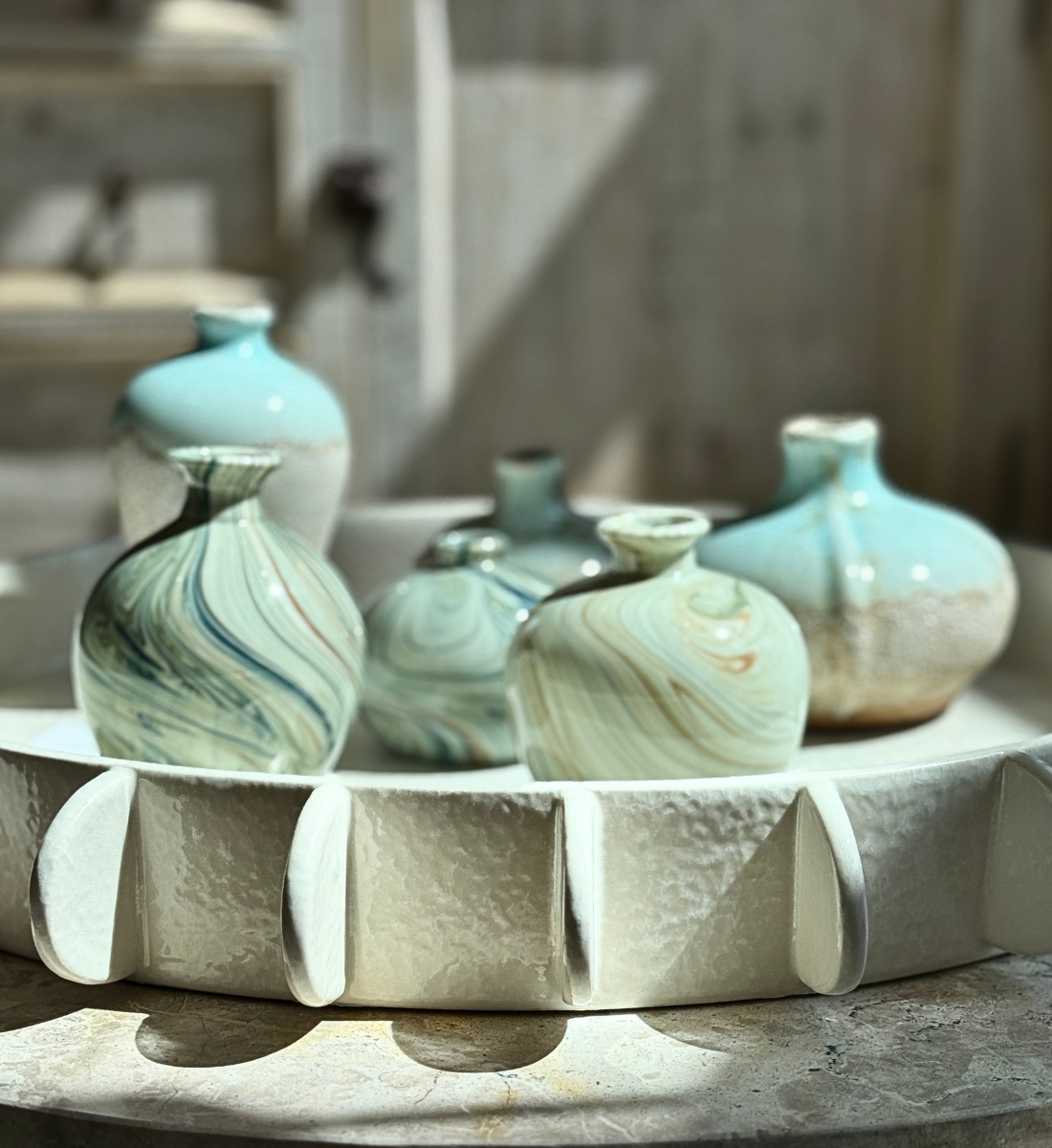 Maude Woods Pasadena home décor boutique display featuring handcrafted ceramic vases, artisan gift items, and decorative home accents.