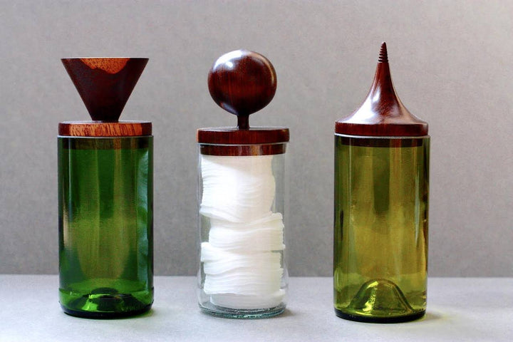 Glass Jar made out of salvaged wine bottles and topped with a luxurious mahogany lid, hand turned to fit each jar. 3" dia x 7.75" h